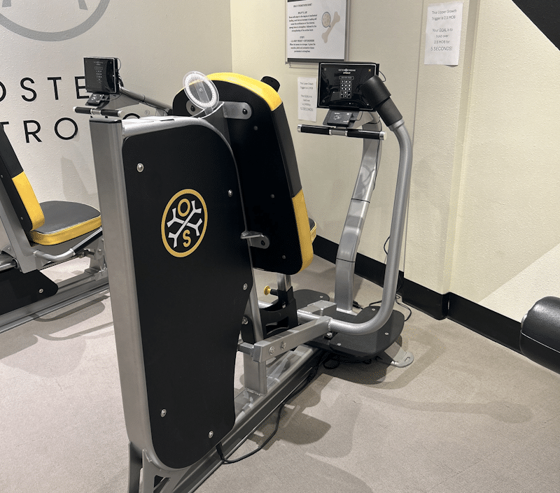 OsteoStrong spectrum machine used for strength training & bone density improvement.