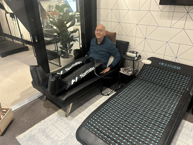 Man relaxing on a hydro massage bed for muscle recovery & improved circulation.